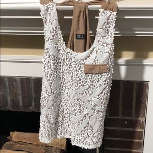 Very J Medium Tank Top. Beige Back. White front.